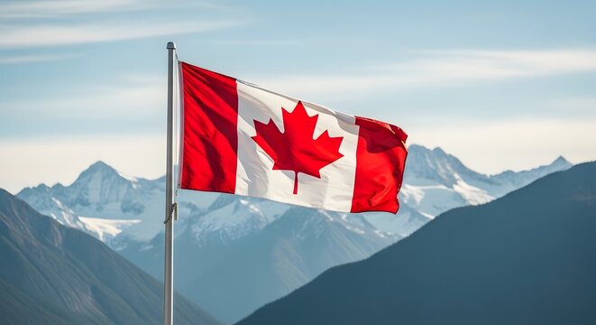 Canadian flag waving in front of a mountain range