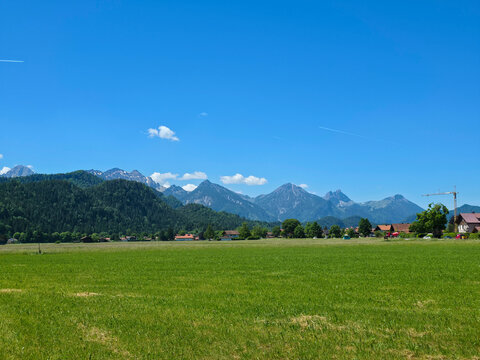 germany, expansive alpine mountain chain beyond emerald pasture creating an inspiring allgaeu summer landscape
