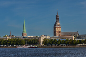 Obraz premium Panorama of Riga Old Town with Daugava River, Dome Cathedral and St. Peter’s Church Spires, Latvia