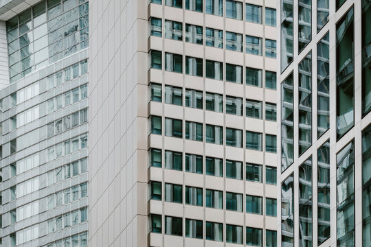 Modern office facades in Frankfurt Bankenviertel, Germany, layer glass and windows across a tight urban view, where architecture builds the financial district