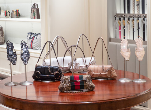 Bags, shoes and belts: luxury accessories in the window of a Gucci store. Milan, Italy, 1 June 2026