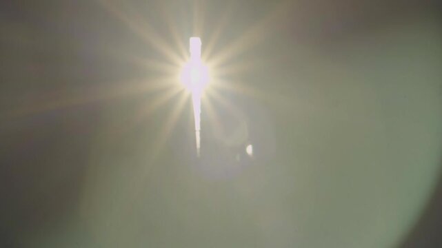 Video featuring beautifully moving particles in the air in dark room, created when sunlight filters through the cracks in the window curtains. Beauty in everyday things, abstract harmony, tranquility