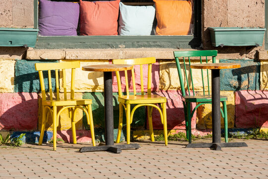 Colorful wooden chairs at an outdoor cafe in Dilijan, Armenia