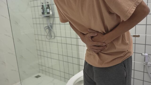 Constipation and diarrhea in bathroom. Hurt man touch belly  stomach ache painful. colon inflammation problem, toxic food, abdominal pain, abdomen, constipated in toilet, stomachache, Hygiene