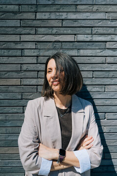 Confident businesswoman in formal suit standing outdoors