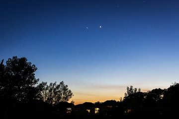 Venus and Jupiter appear together in the sky during sunset, a planetary conjunction. Venus is usually the brightest object visible Jupiter is the second brightest object. © Gilberto Mesquita