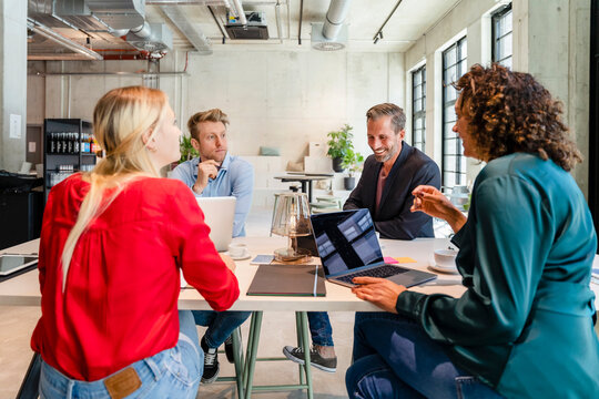 Employees working in meeting at office