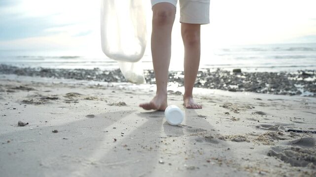 Save water. Volunteer pick up trash garbage at the beach and plastic bottles are difficult decompose prevent harm aquatic life. Earth, Environment, Greening planet, reduce global warming, Save world