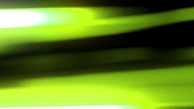 light wife transition from black to bright green streaks, dynamic and abstract motion. This video is ideal for creating visual effects and transitions.