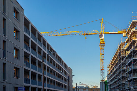Germany, Bavaria, Munich, Construction site in Prinz-Eugen-Park complex with industrial crane standing in background