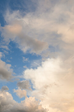 Orange clouds portrait and cloudscape with blue sky