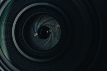 Close-up of a Camera Lens Aperture Blades,Macro,A detailed macro shot capturing the intricate circular aperture blades inside a professional camera lens, highlighting the precision engineering. © banjongseal324
