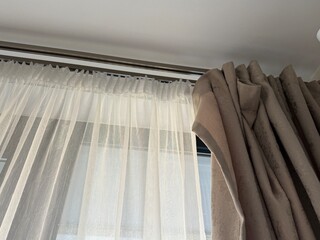Curtains in modern home interior provide soft light and privacy, ideal for stylish living spaces © dvoevnore