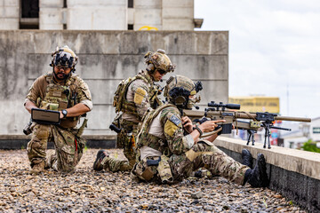 Fototapeta premium Sniper Team Conducting Rooftop Overwatch