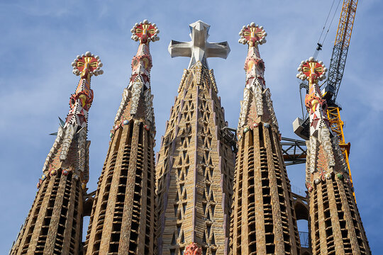 La Sagrada Familia - impressive cathedral designed by Gaudi. Tower, dedicated to Jesus Chris with huge three-dimensional four-pointed cross. BARCELONA, SPAIN.