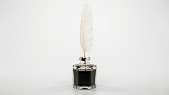 Feather Quill Pen in Glass Inkwell Isolated White Background - Constitution Concept Symbol - Writing Metaphor for Founding Documents, History, and Freedom of Expression