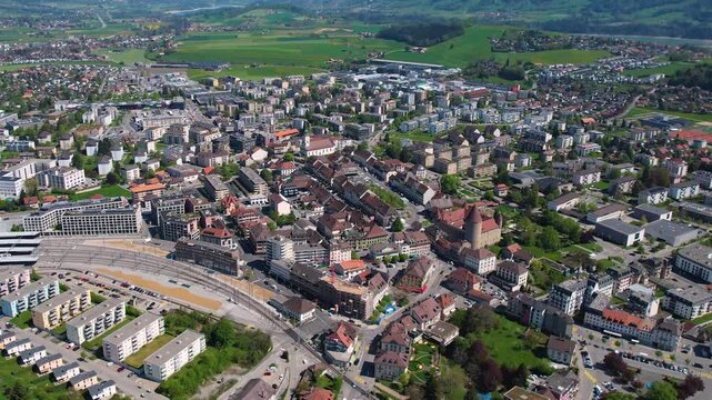 An aerial view beside the city and e old town of Bulle in Switzerland on a sunny noon in spring.
