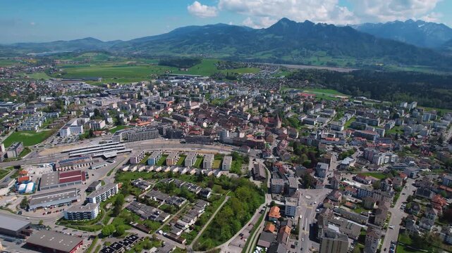 An aerial view beside the city and e old town of Bulle in Switzerland on a sunny noon in spring.