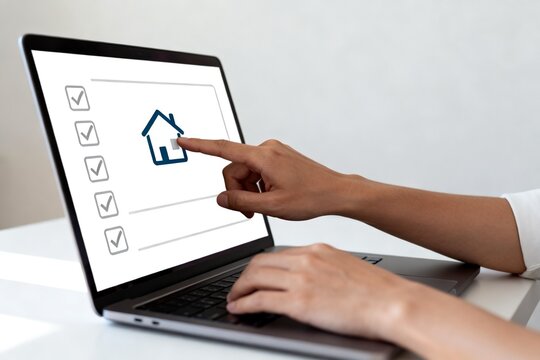 Person using laptop for online home selection