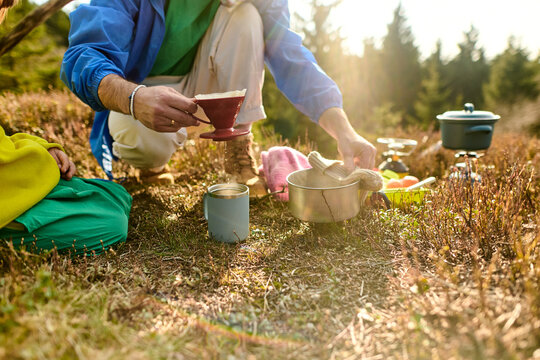 Preparing coffee during outdoor camping break