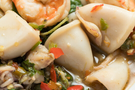 Close-Up of Homemade Pad Krapow (Thai Holy Basil Stir-Fry) with Shrimp and Squid, a Spicy and Appetizing Thai Seafood Dish