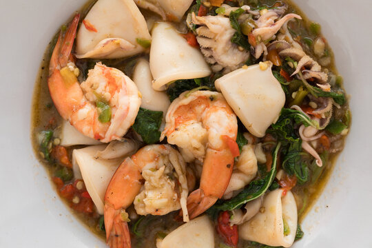 Close-Up of Homemade Pad Krapow (Thai Holy Basil Stir-Fry) with Shrimp and Squid, a Spicy and Appetizing Thai Seafood Dish