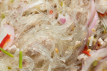 Close-Up of Yum Woon Sen (Thai Glass Noodle Salad) with Minced Pork, Appetizing Food Concept © Latthaphon