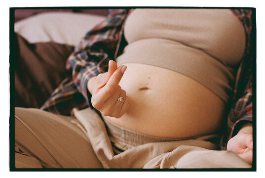 Pregnant woman shows affection to her belly