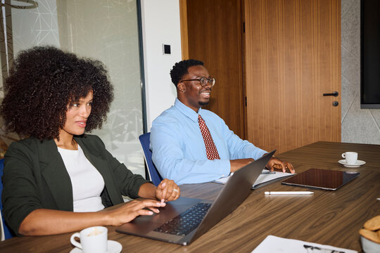 Colleagues attend a meeting