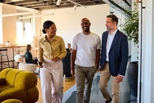 Colleagues talking in the corporate hallway