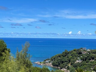 Fototapeta premium Views from observation decks of islands, ocean, and sky in Vallee de Mai National Park (UNESCO World Heritage Site) in central Praslin Island, Seychelles