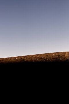 solated Plateau Mountain at Sunset Over Desert Plain With Warm Light 