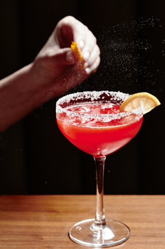 Red cocktail with zest