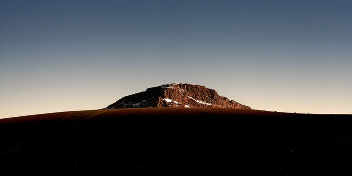 solated Plateau Mountain at Sunset Over Desert Plain With Warm Light 