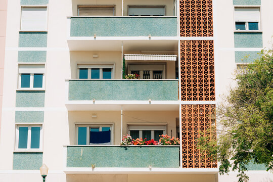 Apartment building facade with pastel balconies