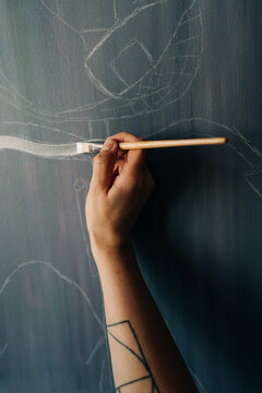 Female painter painting on canvas