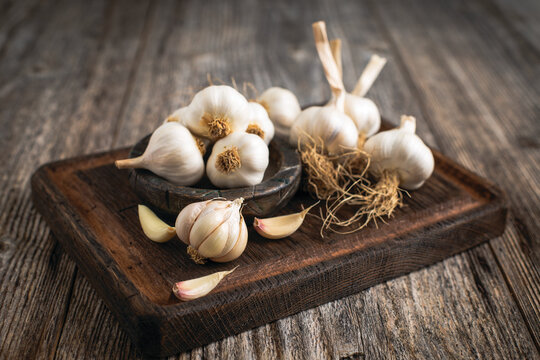 Fresh organic garlic on the wooden table	

