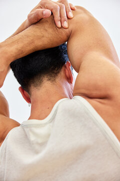Stretching exercise for shoulder flexibility at gym