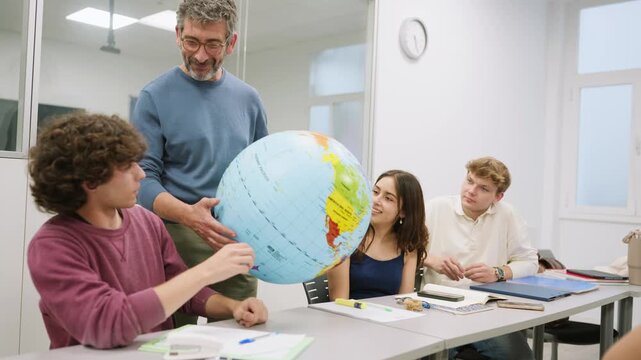 Teacher explaining geography to students using an inflatable globe