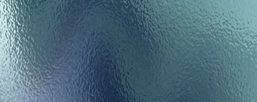A close-up view of a textured surface, possibly frosted glass, with swirling patterns of blue and green.