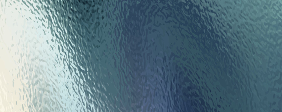A close-up view of a textured surface, possibly frosted glass, with swirling patterns of blue and green.