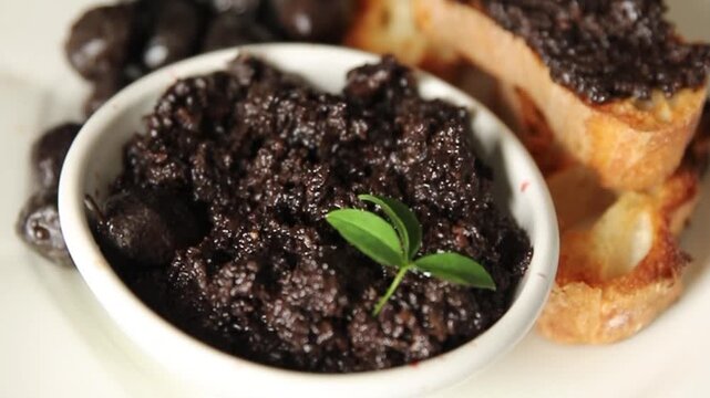Tapenade black olives olive spread ready to eat tasty snack fresh and delicious gourmet food background rustic food on the table top view copy space