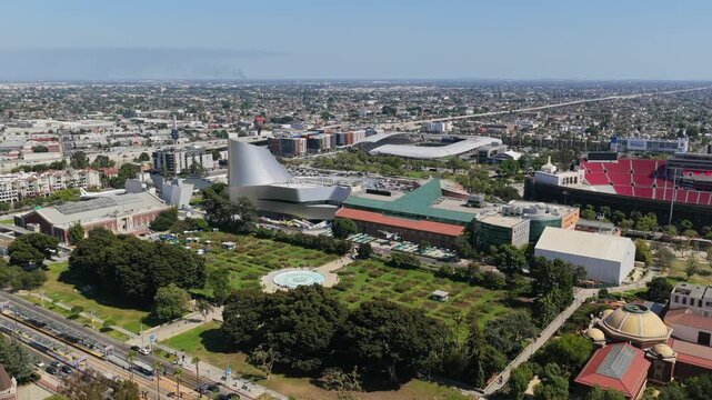 Exposition Park, California Science Center, Natural History Museum in Los Angeles showing Exposition Boulevard and BMO Stadium in South Los Angeles