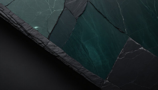 Macro texture of dark volcanic stone with inlaid geometric green jasper tiles