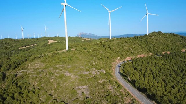 Wind Farm and Mountain Road in Mediterranean Forest Landscape