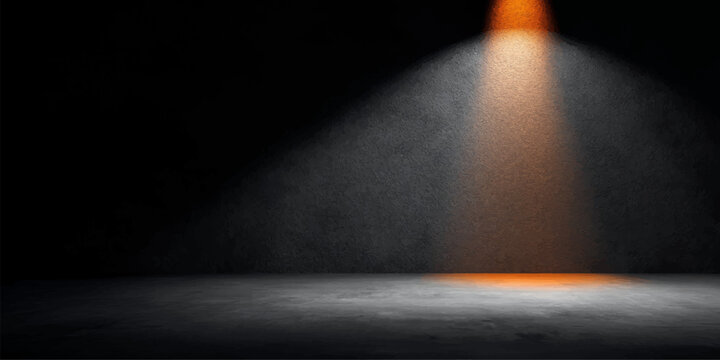 Spotlight on stage wall in a dark theater with bright light and blue glow background