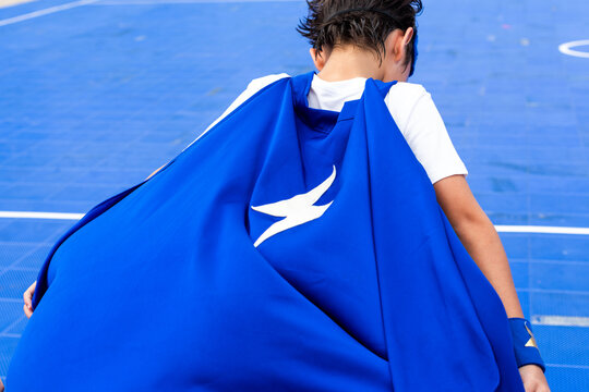 Child superhero blue cape action