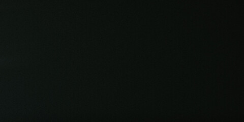 Obraz premium Deep black textured surface with subtle grain patterns