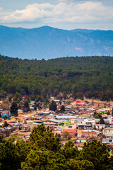 Fototapeta premium Populated in the middle of a forest in the mountains, 