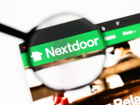 Milan, Italy 2026, 20 Apr Closeup of nextdoor website on a laptop screen. nextdoor logo under a magnifying glass.